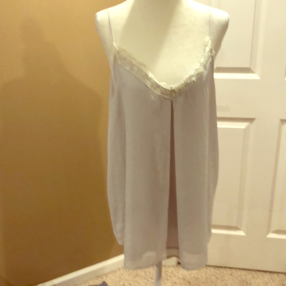 Light gray sleeveless blouse with lace